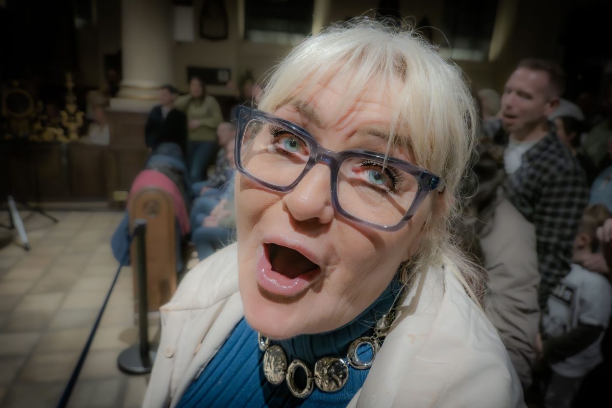 Lady singing withe her eyes wide open at derby cathedral