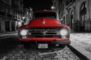 Red vintage truck on a cobblestone street at night – digital download photo