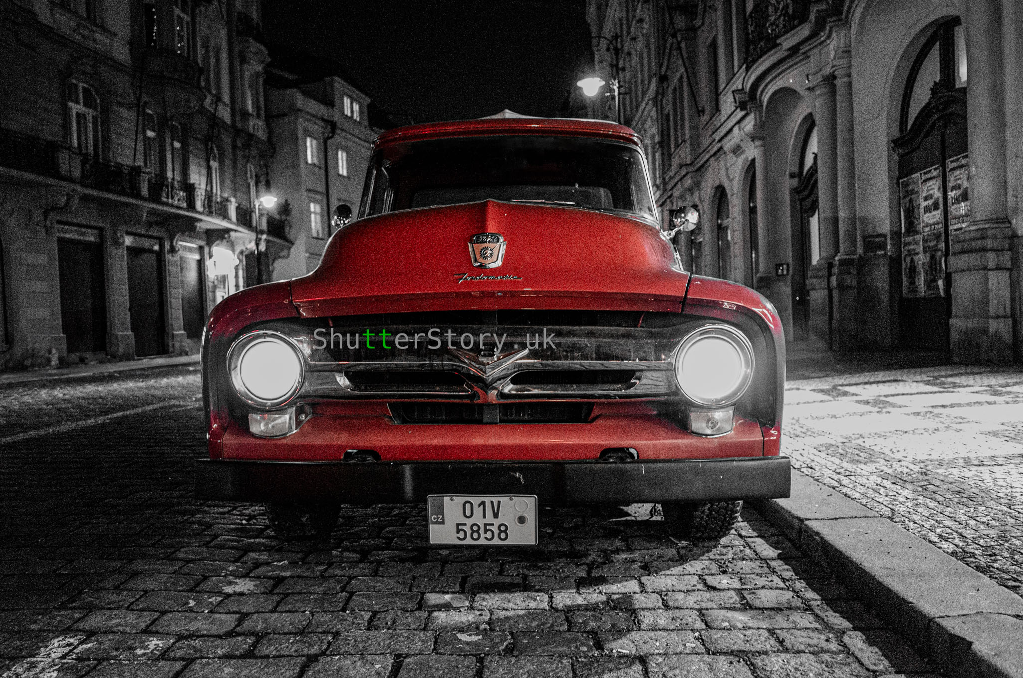 Red vintage truck on a cobblestone street at night – digital download photo