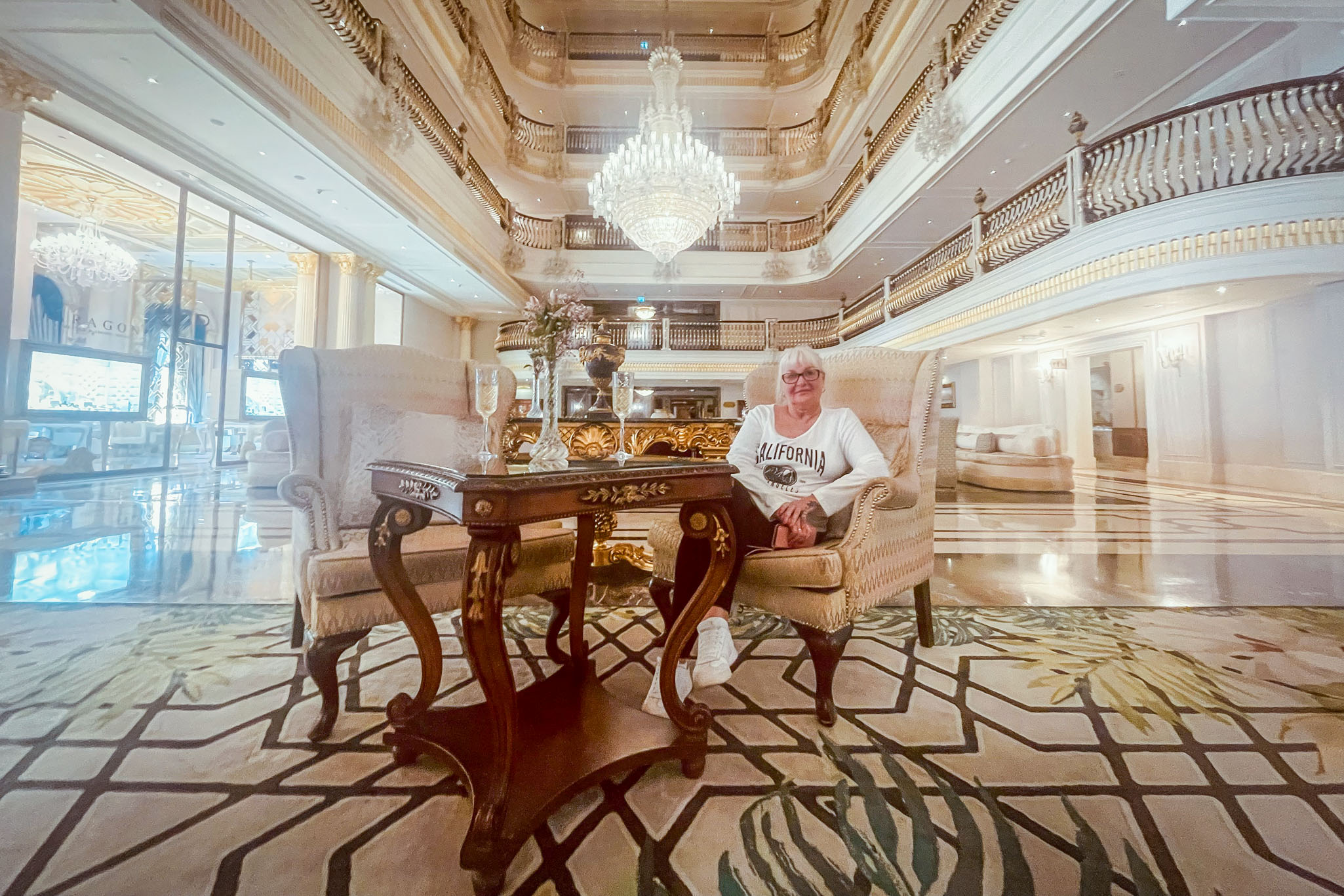 Opulent lobby of the Titanic Mardan Palace in Antalya with grand chandeliers and luxury seating
