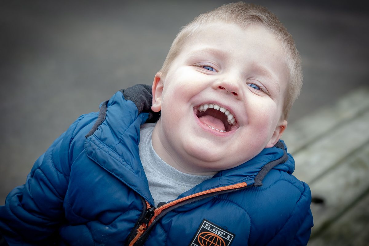 Young boy with a huge smile at Wheelgate theme park in nottinghamshire
