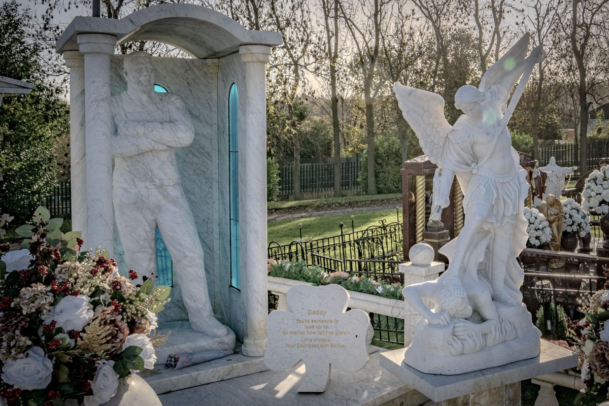 Close-up of carved details and artwork on the Willy Collins memorial.