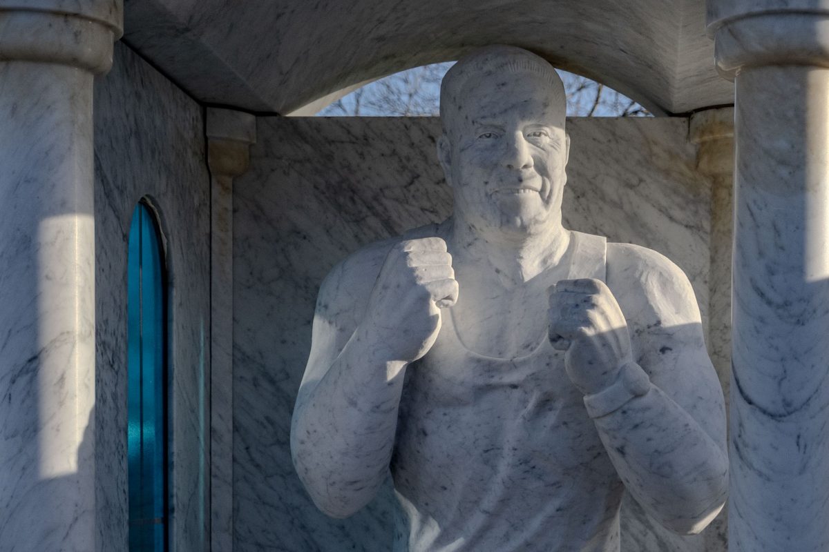 Close-up view of the Willy Collins memorial statue showing facial detail.