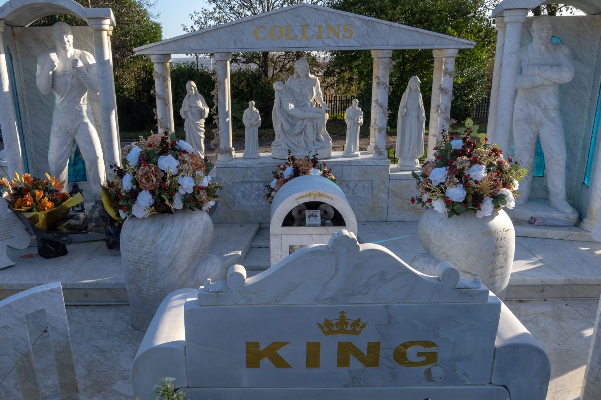 Life-size marble statue of Willy Collins in a boxing pose at his memorial