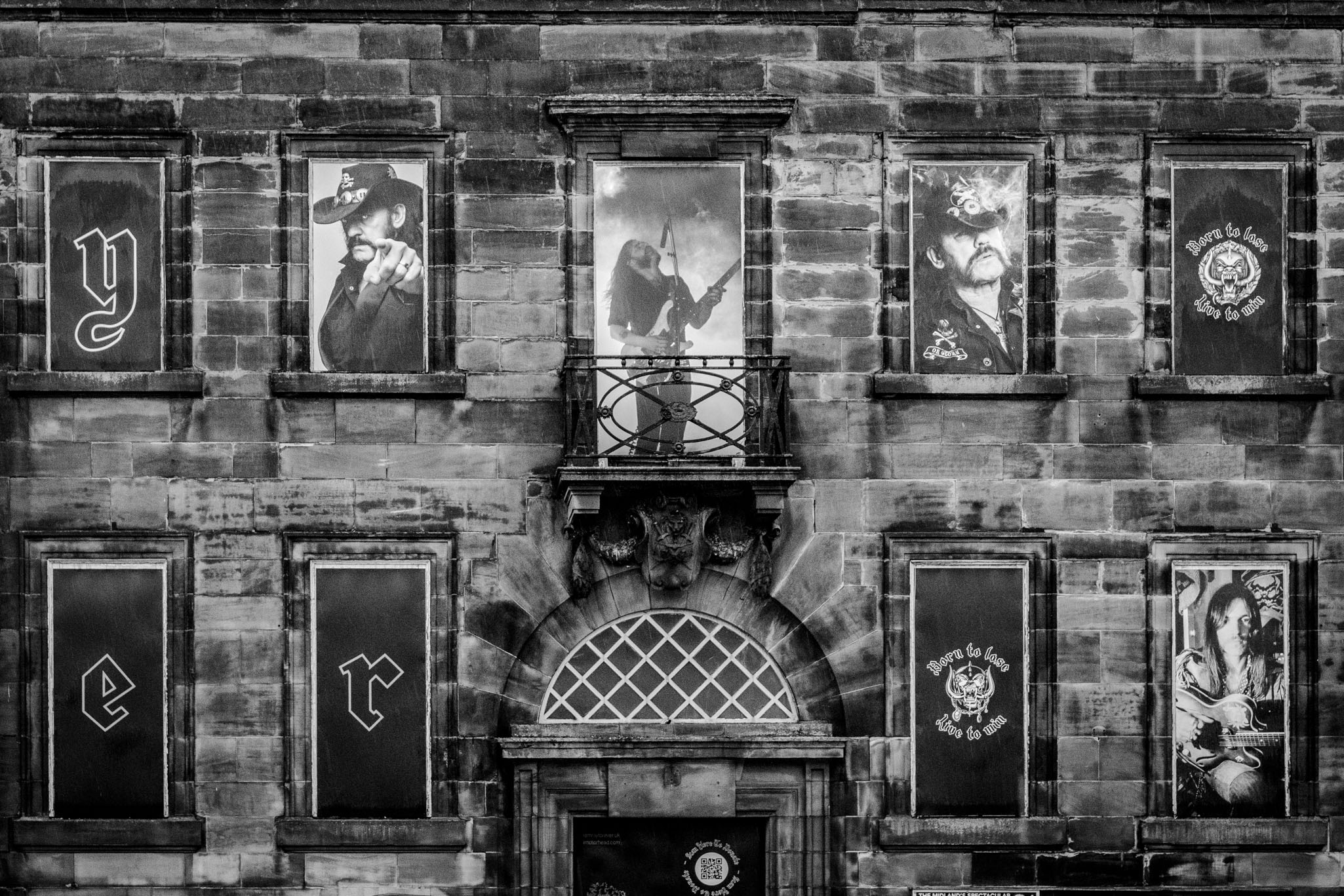 Close-up of the Lemmy Kilmister tribute windows on the Former Post Office Building in Burslem.