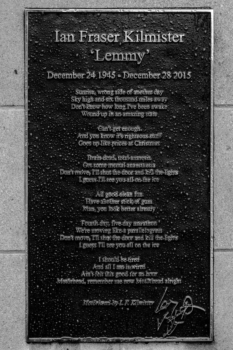 Black and white photo of the memorial plaque for Ian Fraser Kilmister 'Lemmy' with lyrics inscribed.