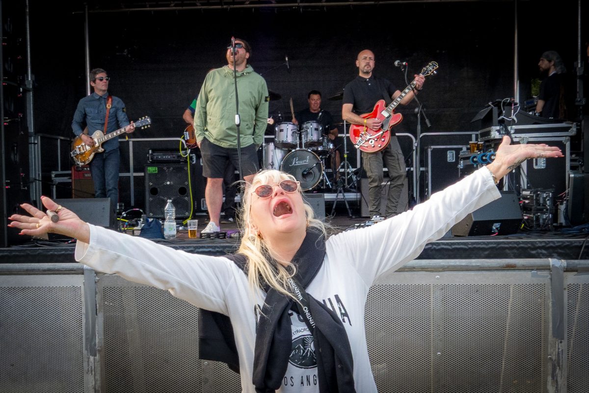 Live band performing on stage at Spongefest festival.