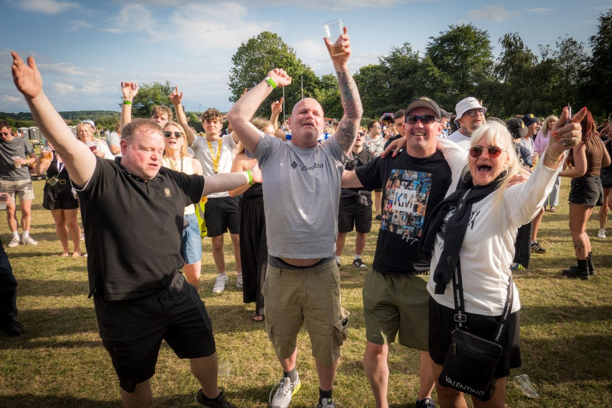 Cheering crowd raising hands at Spongefest Worksop