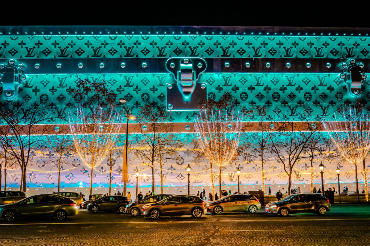 The Louis Vuitton building on Champs-Élysées designed to look like a giant monogrammed trunk at night.
